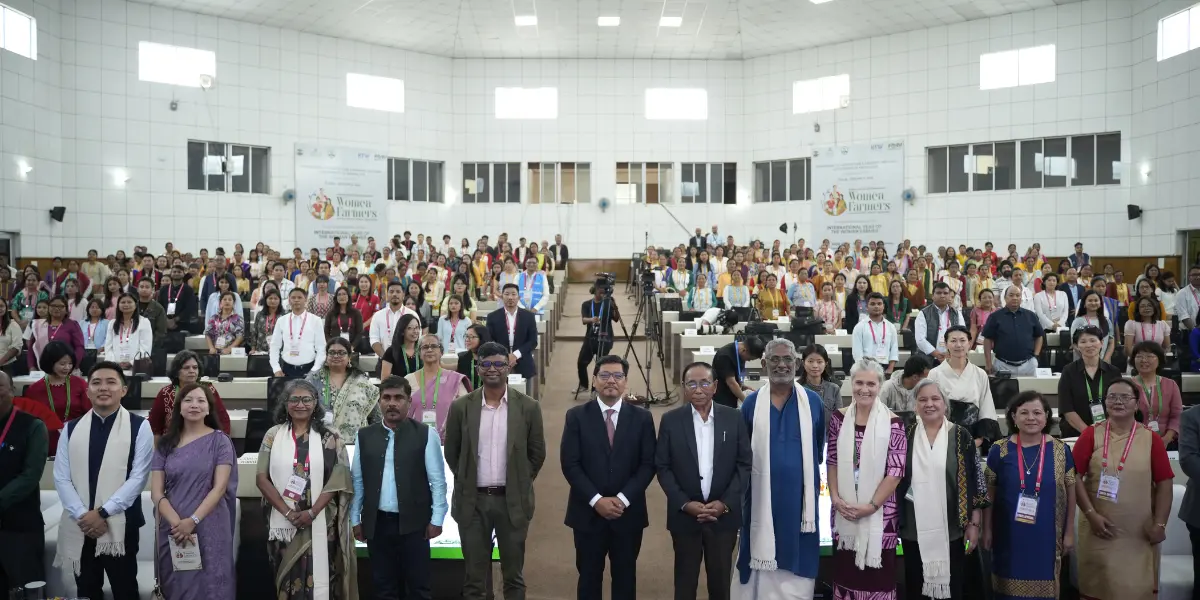 Delegates and Participants of the International Conference on Women Farmers and Organic Food Systems posing for a photo in the main auditorium